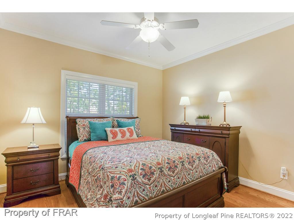 1517 Epic Way Hope Mills, NC 28348 - Photo 16 of 36 a bedroom with a bed and a lamp
