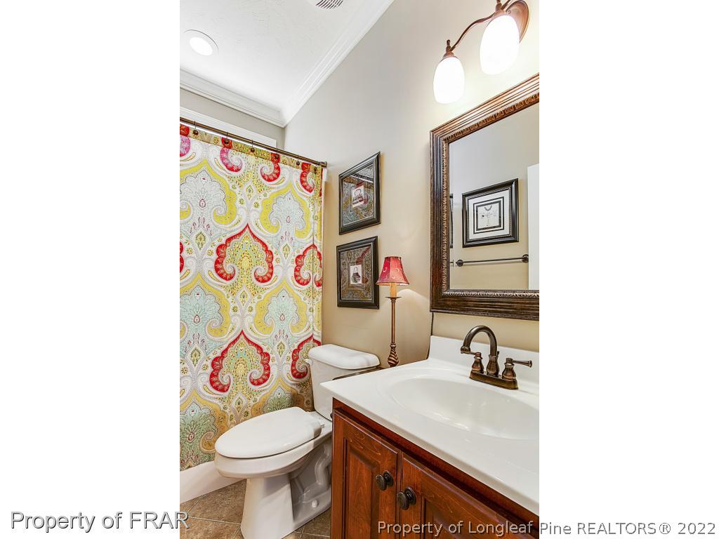 1517 Epic Way Hope Mills, NC 28348 - Photo 18 of 36 a bathroom with a sink toilet and a mirror