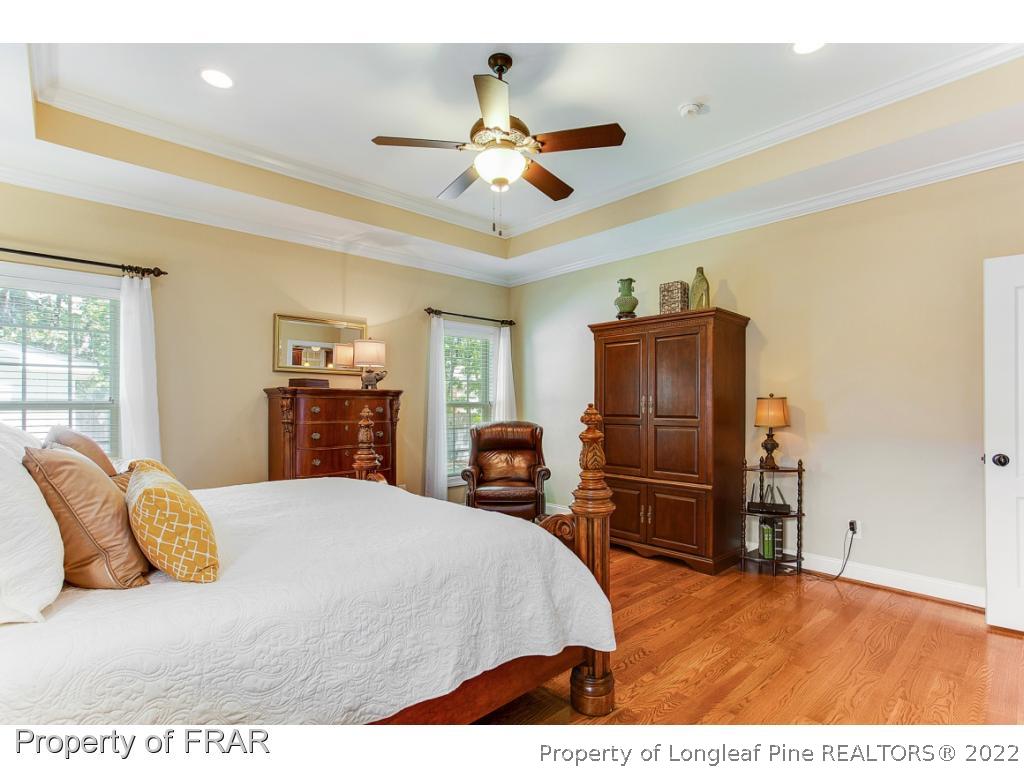 1517 Epic Way Hope Mills, NC 28348 - Photo 20 of 36 a bedroom with a bed and dresser with mirror