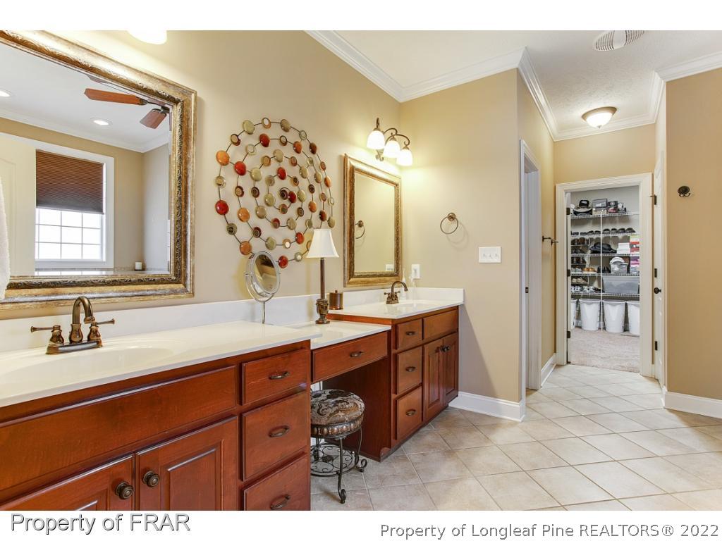 1517 Epic Way Hope Mills, NC 28348 - Photo 21 of 36 a bathroom with a sink double vanity and a mirror