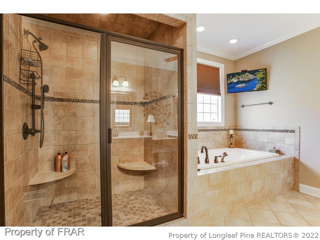 1517 Epic Way Hope Mills, NC 28348 - Photo 22 of 36 a bathroom with a tub and a sink