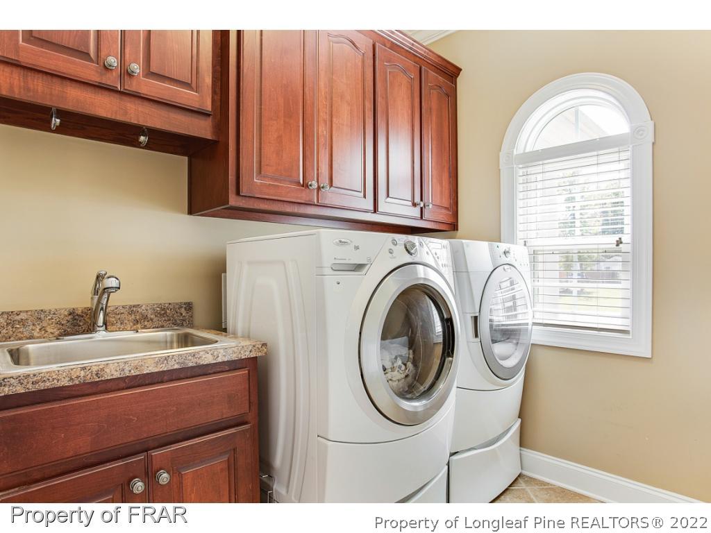 1517 Epic Way Hope Mills, NC 28348 - Photo 25 of 36 a utility room with sink dryer and washer