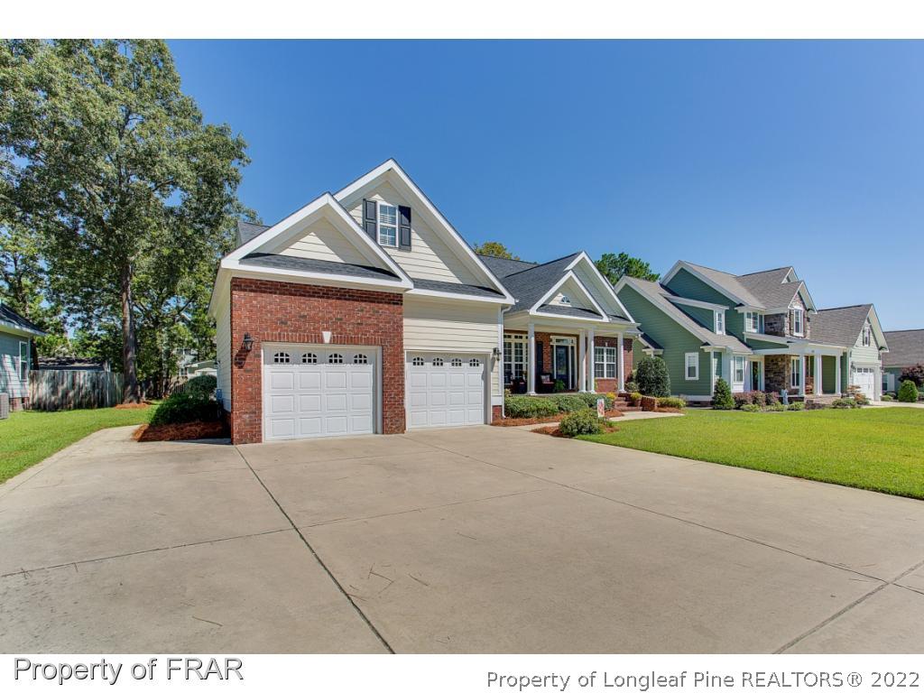 1517 Epic Way Hope Mills, NC 28348 - Photo 3 of 36 a front view of a house with a yard and garage
