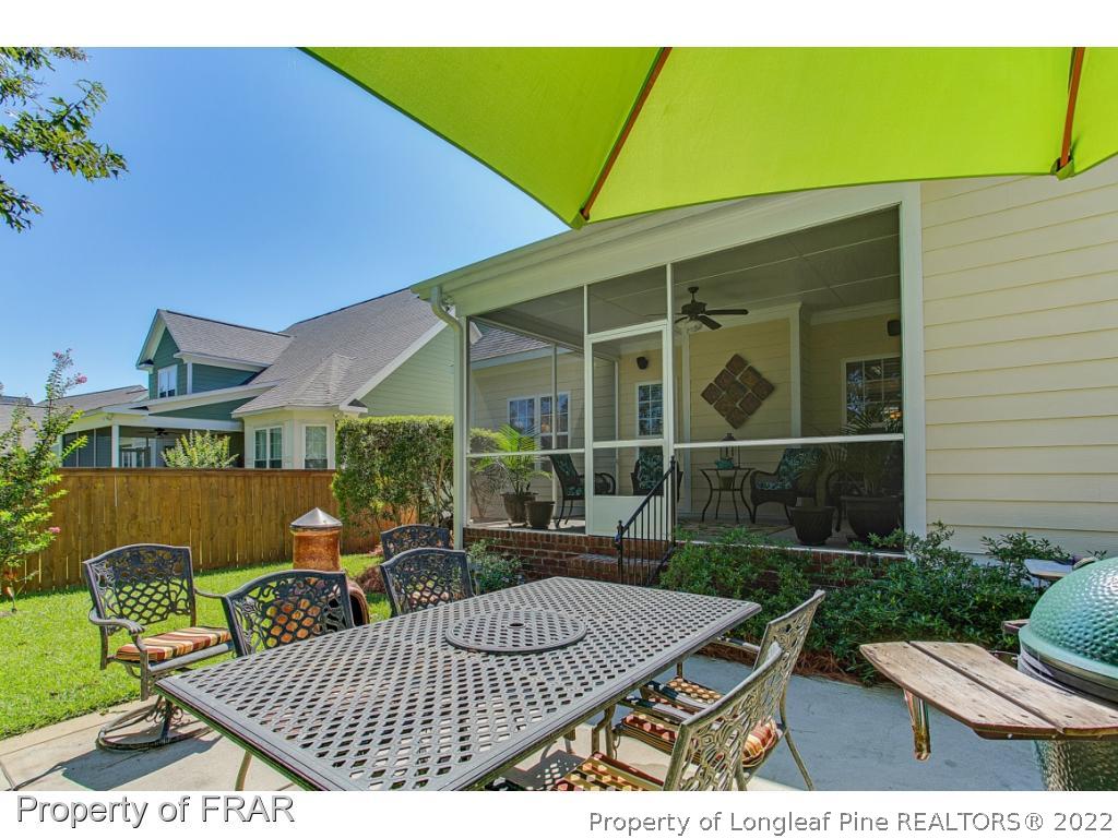 1517 Epic Way Hope Mills, NC 28348 - Photo 33 of 36 a view of backyard with outdoor seating a patio and plants