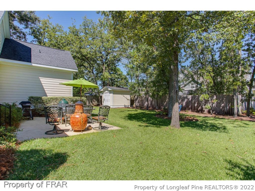 1517 Epic Way Hope Mills, NC 28348 - Photo 34 of 36 a backyard of a house with table and chairs