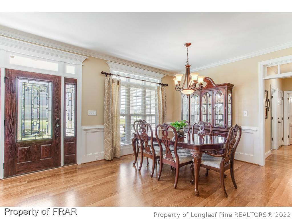 1517 Epic Way Hope Mills, NC 28348 - Photo 6 of 36 a view of a dining room with furniture window and wooden floor