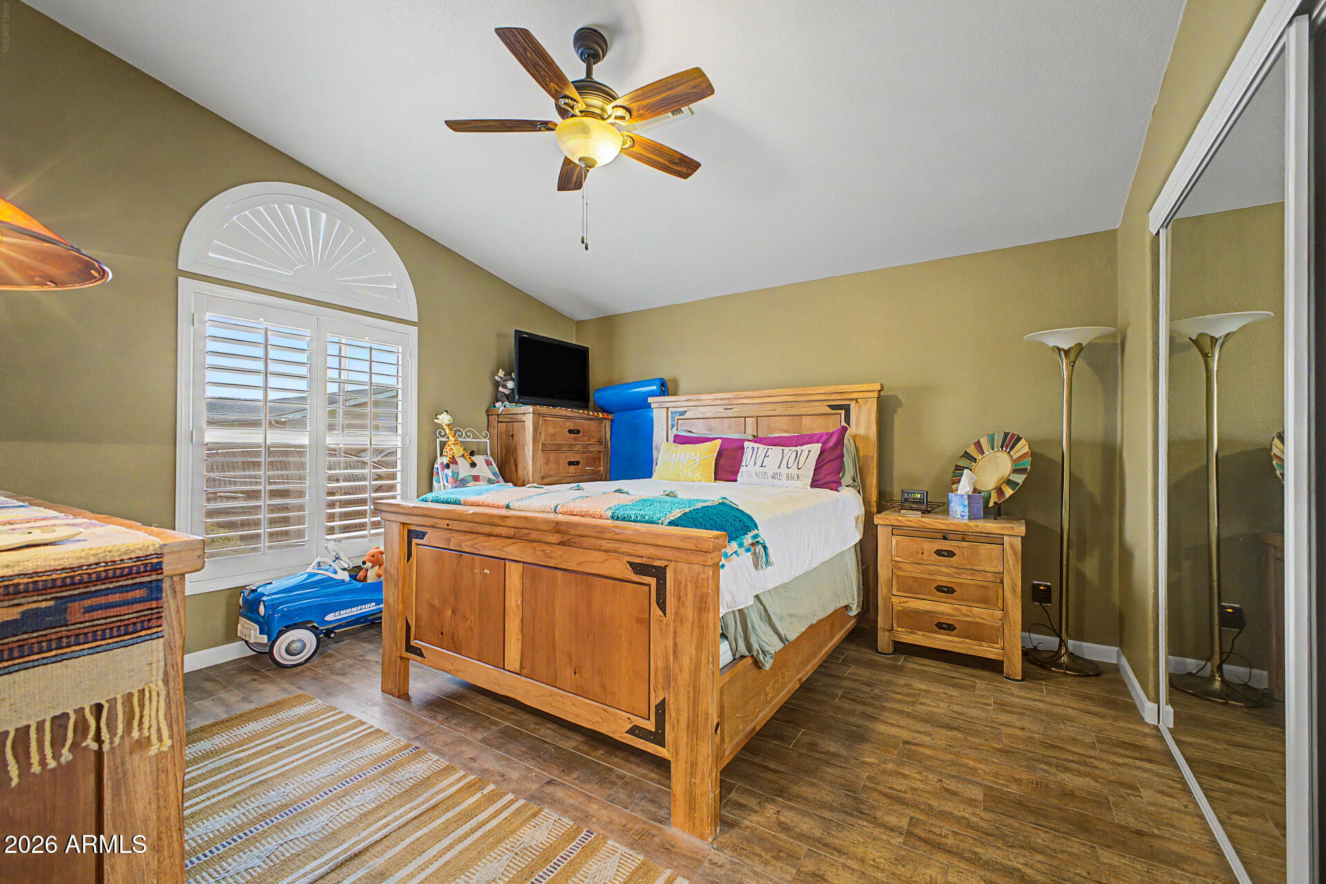 2550 South Ellsworth Road, Unit 611 Mesa, AZ 85209 - Photo 11 of 34 a bed room with a bed and a chandelier