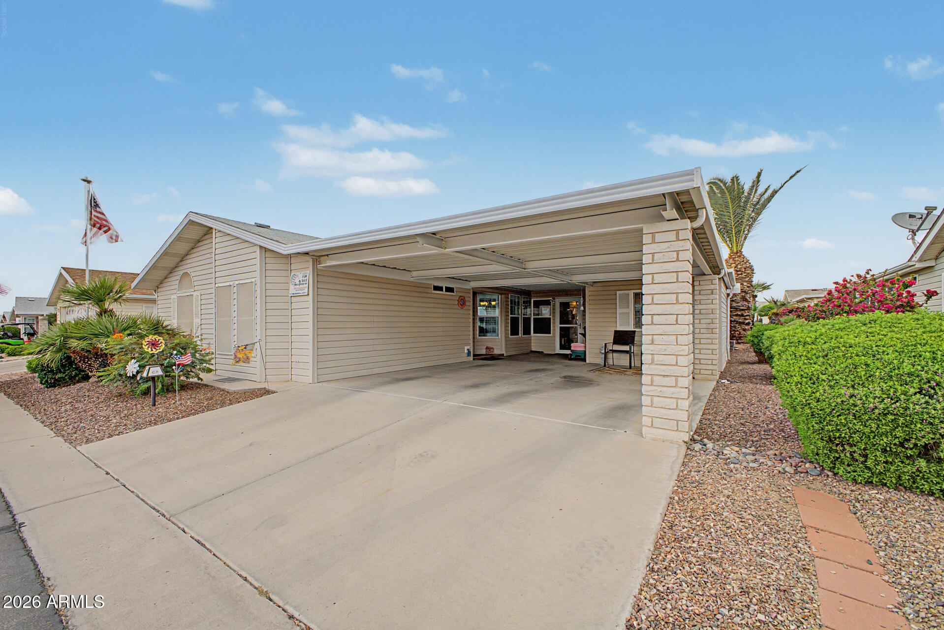 2550 South Ellsworth Road, Unit 611 Mesa, AZ 85209 - Photo 14 of 34 a view of a house with a yard and potted plants