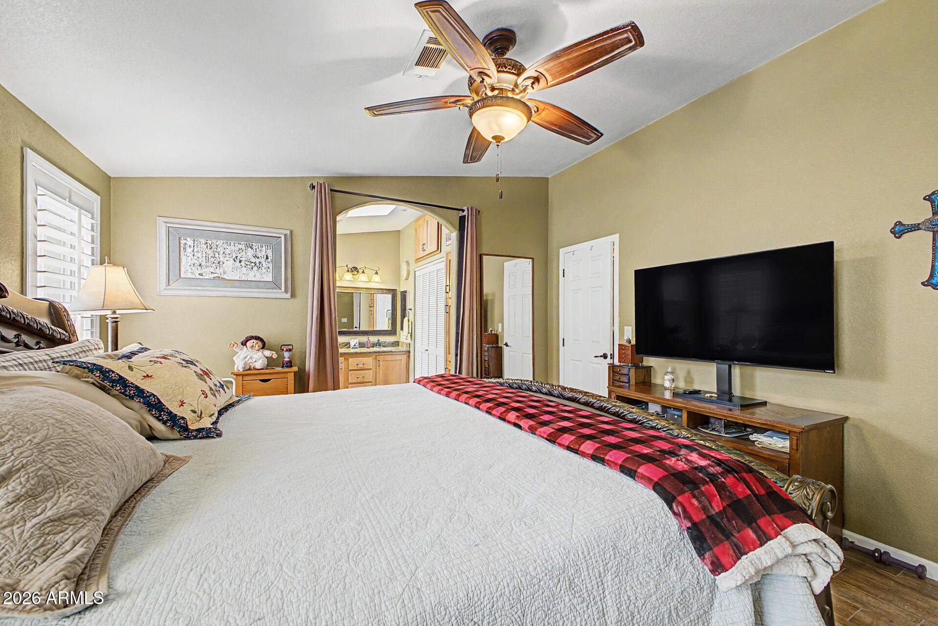 2550 South Ellsworth Road, Unit 611 Mesa, AZ 85209 - Photo 20 of 34 a bedroom with a bed and a flat screen tv