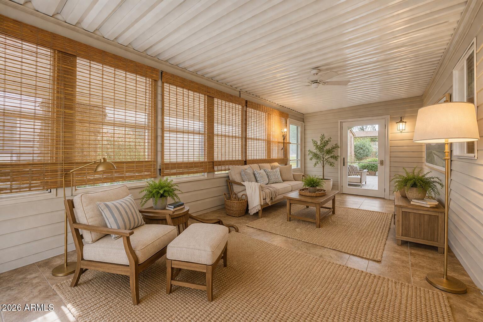 2550 South Ellsworth Road, Unit 611 Mesa, AZ 85209 - Photo 2 of 34 a living room with furniture and a large window