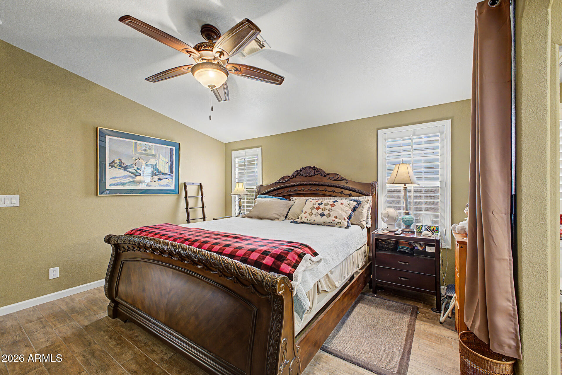 2550 South Ellsworth Road, Unit 611 Mesa, AZ 85209 - Photo 21 of 34 a bedroom with a bed and a chandelier