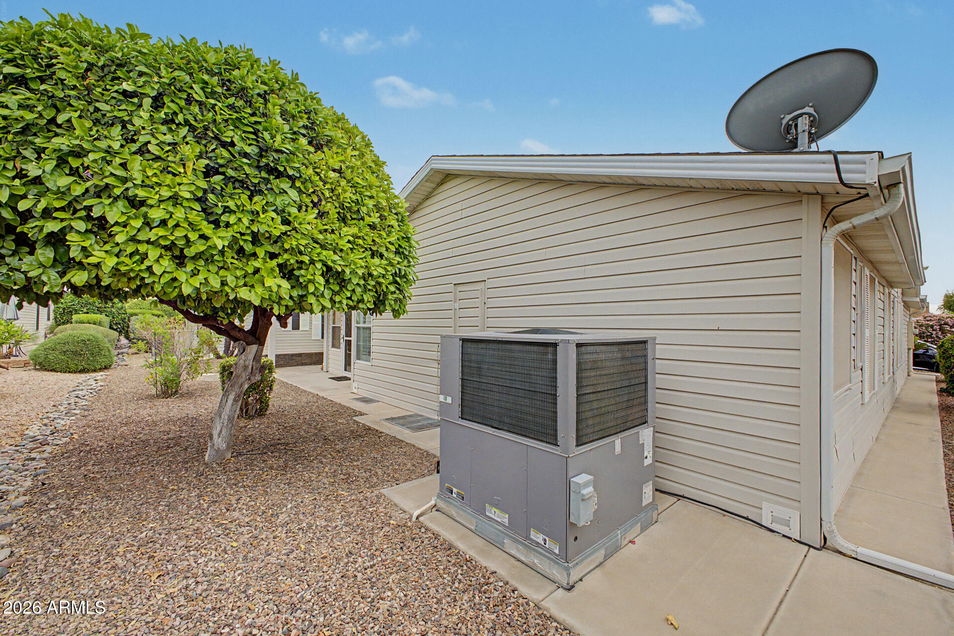 2550 South Ellsworth Road, Unit 611 Mesa, AZ 85209 - Photo 24 of 34 a view of a porch with a bench and trees