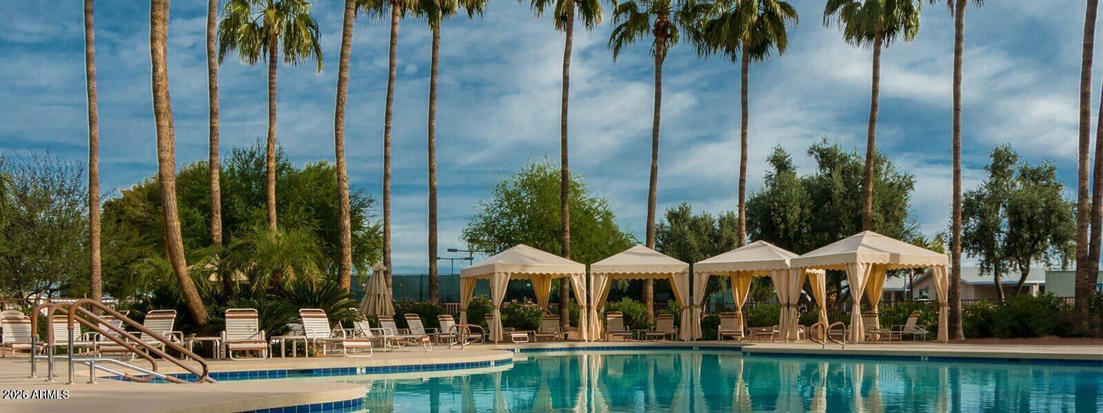 2550 South Ellsworth Road, Unit 611 Mesa, AZ 85209 - Photo 30 of 34 a view of a chairs and table and chairs in front of house