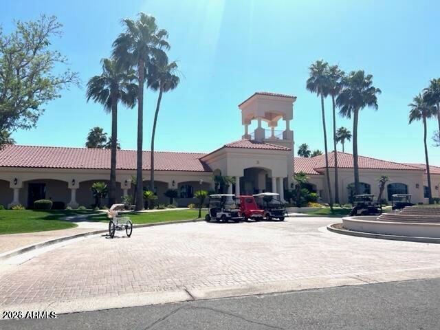 2550 South Ellsworth Road, Unit 611 Mesa, AZ 85209 - Photo 31 of 34 a view of a street with a building and a table and chairs