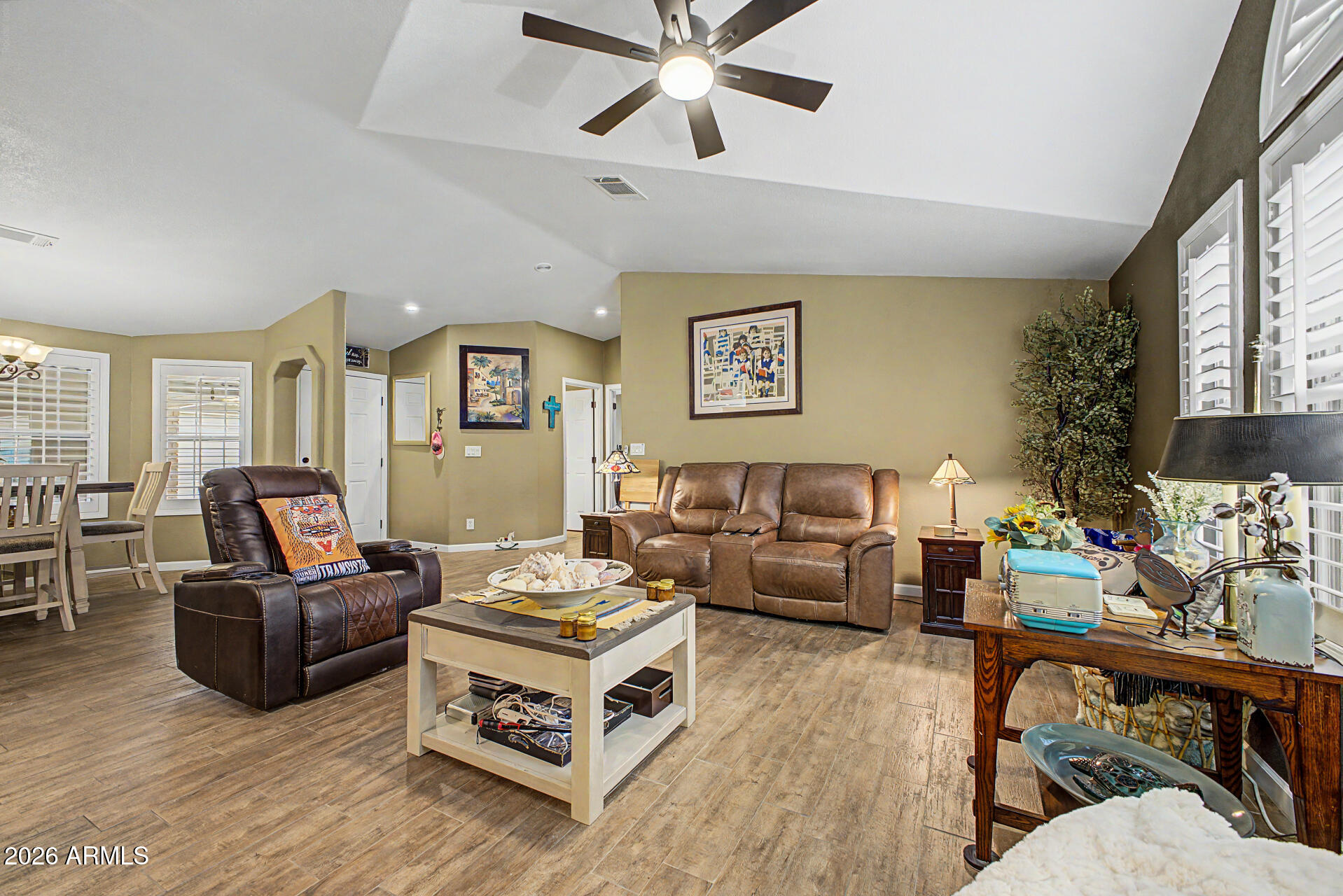 2550 South Ellsworth Road, Unit 611 Mesa, AZ 85209 - Photo 4 of 34 a living room with furniture and a large window