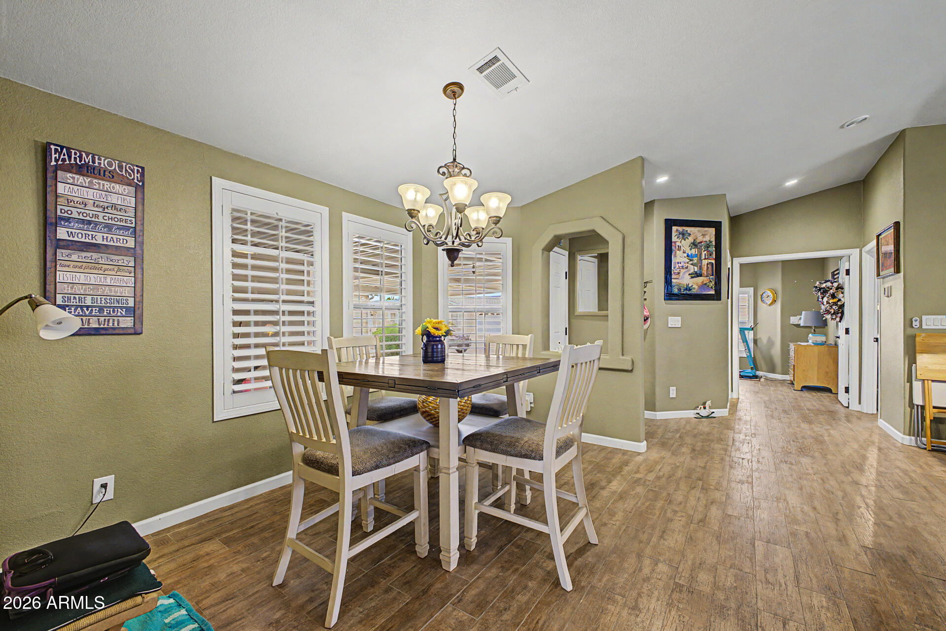 2550 South Ellsworth Road, Unit 611 Mesa, AZ 85209 - Photo 5 of 34 a view of a dining room with furniture and window