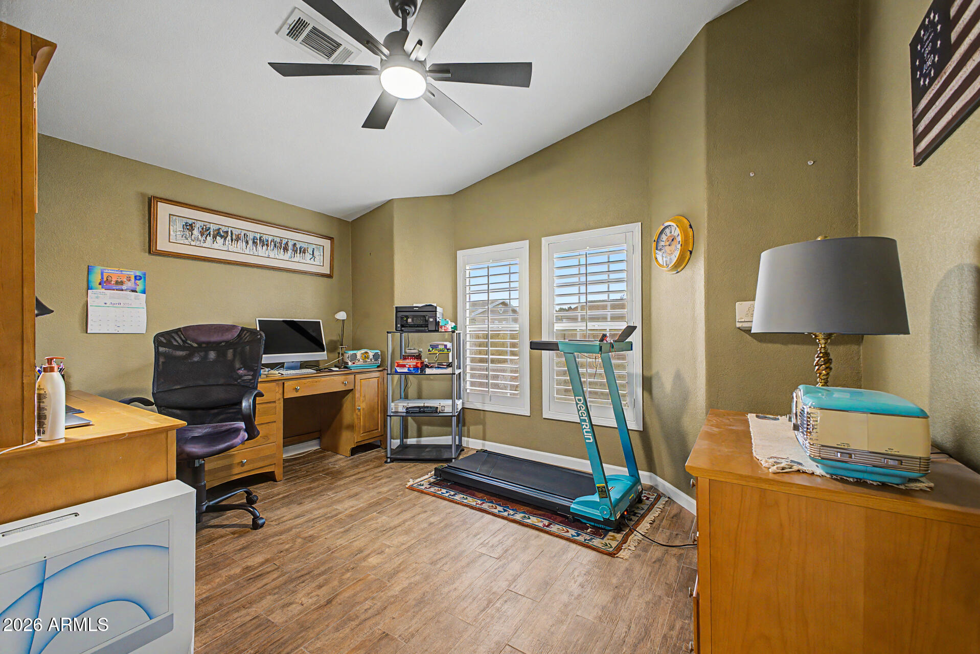 2550 South Ellsworth Road, Unit 611 Mesa, AZ 85209 - Photo 9 of 34 a bedroom with furniture and a wooden floor