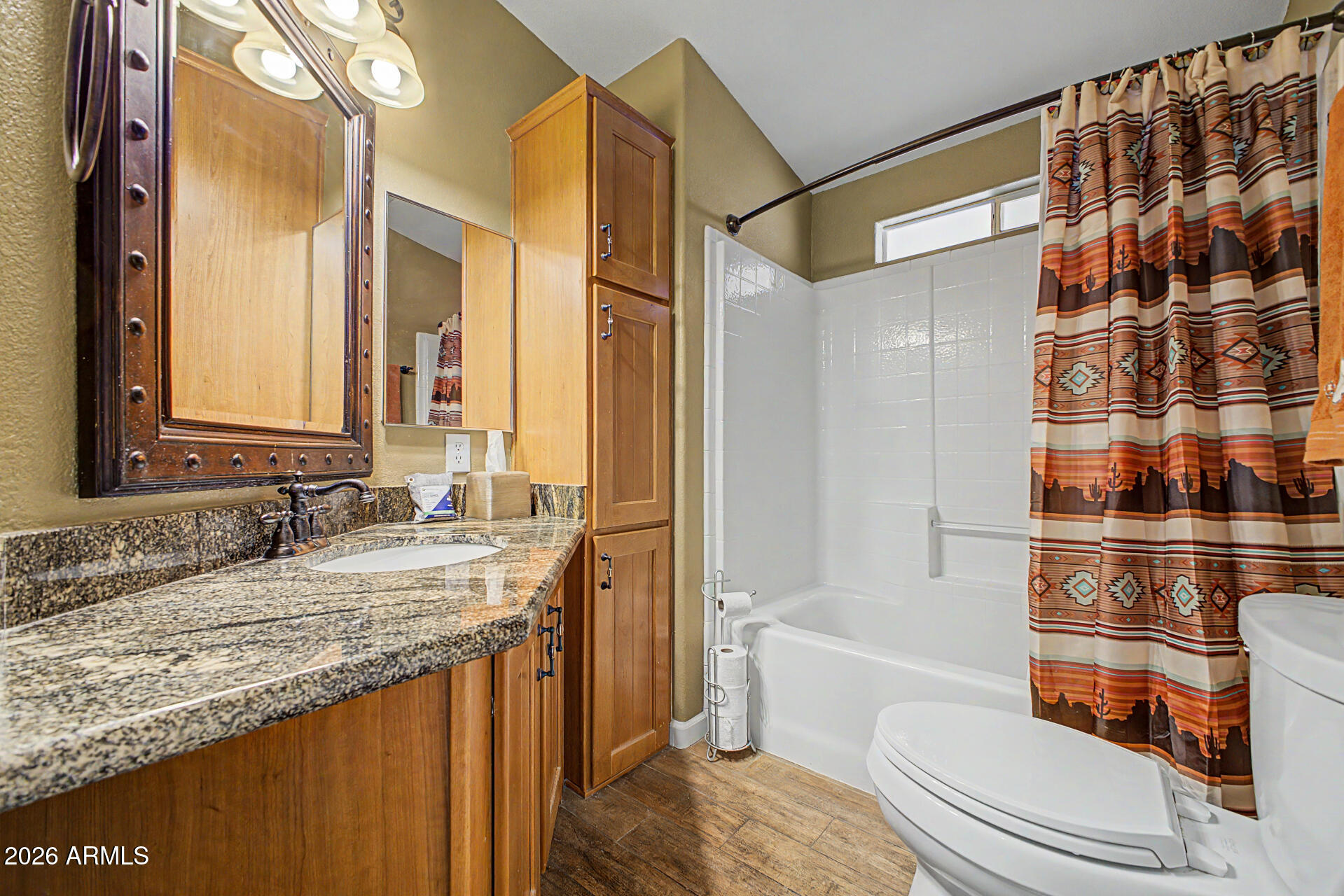 2550 South Ellsworth Road, Unit 611 Mesa, AZ 85209 - Photo 10 of 34 a bathroom with a granite countertop sink toilet and shower