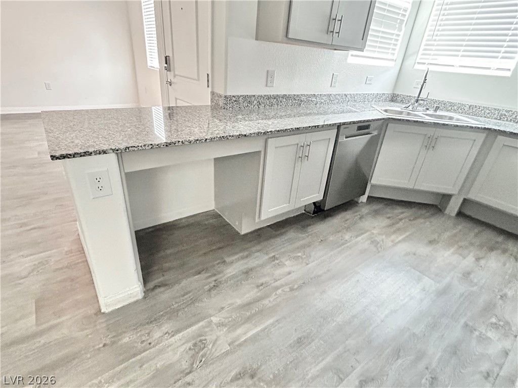 12186 Azure Gate Road, Unit 1 Las Vegas, NV 89183 - Photo 4 of 32 kitchen includes niche for wheelchair accessibility and functionality
