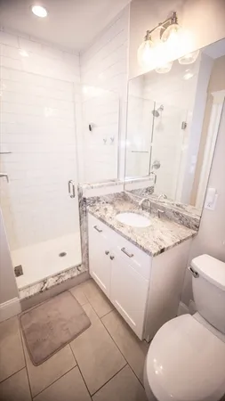 a view of a wooden deck and a yard