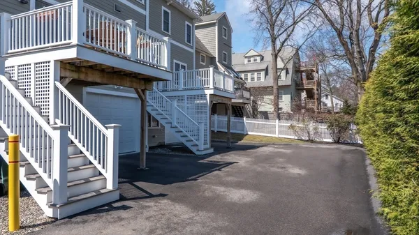 a view of a house with wooden deck