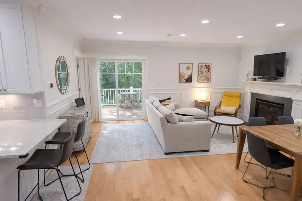 a living room with furniture fireplace and flat screen tv