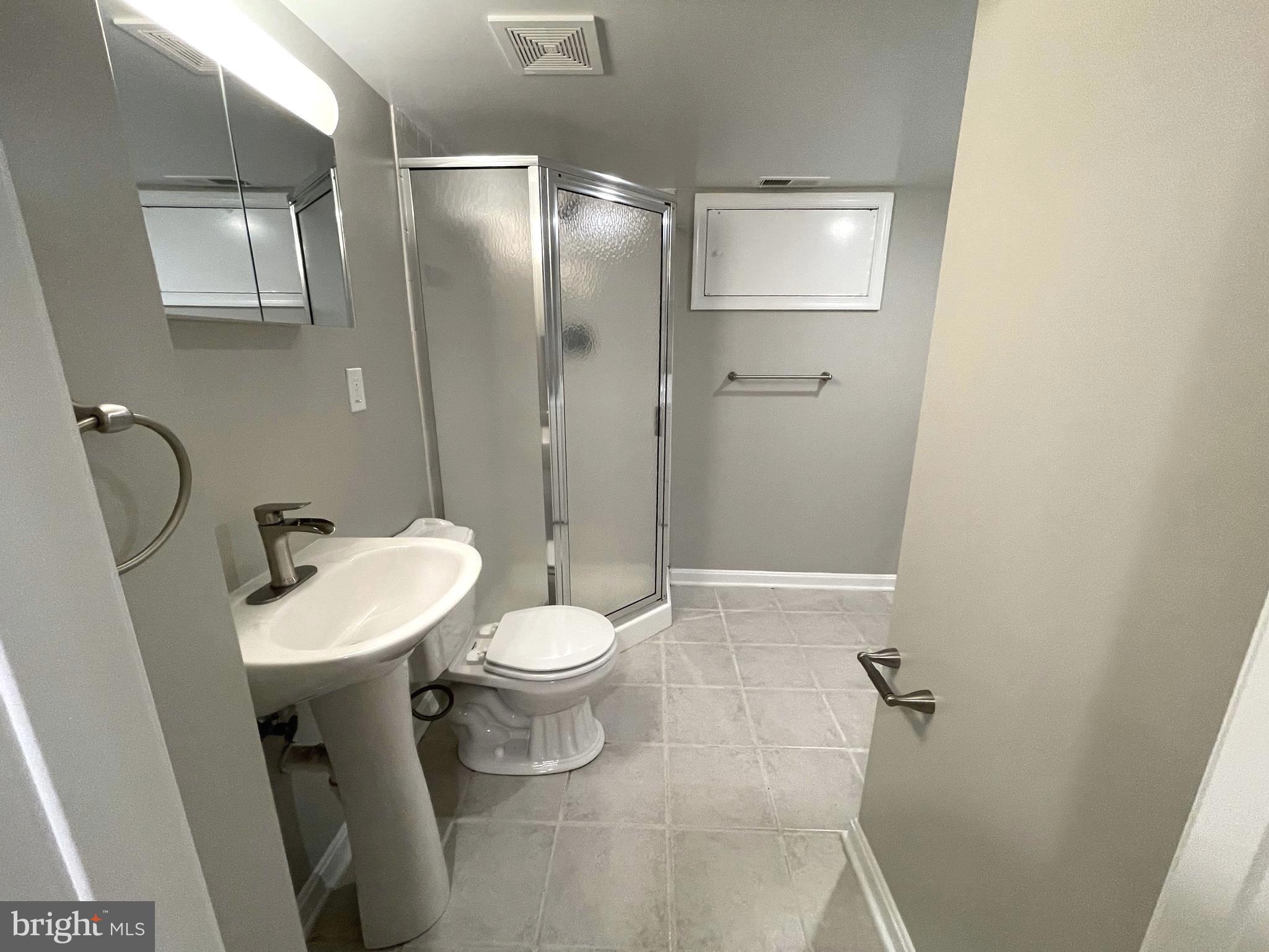 236 Meadow Road Pasadena, MD 21122 - Photo 28 of 28 Full Bathroom #3 with a lower level laundry area