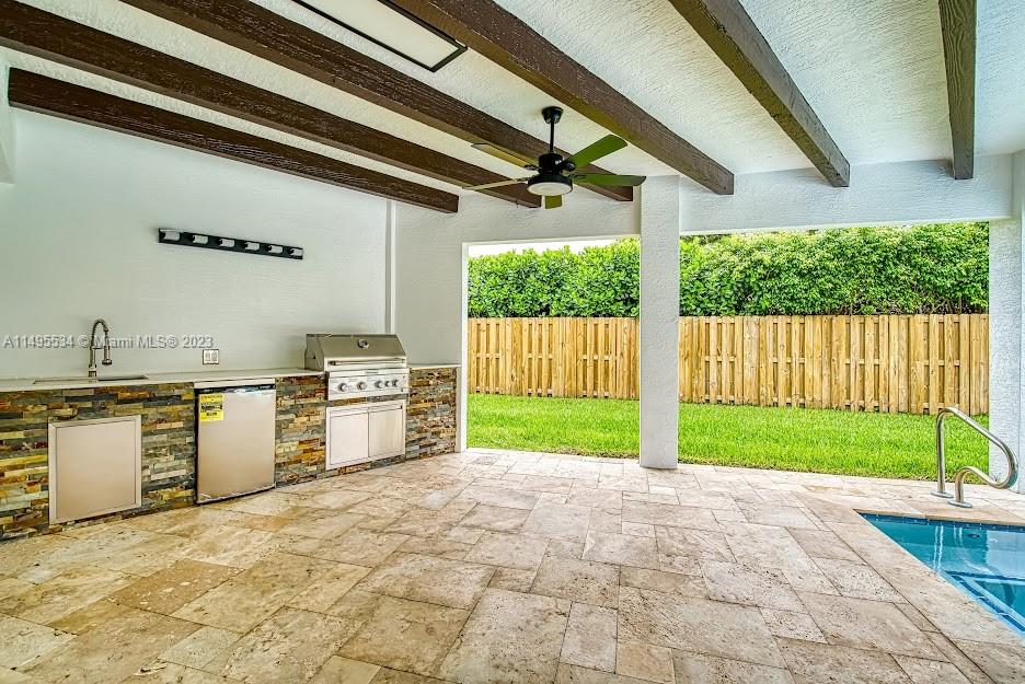 3010 Equestrian Drive Boca Raton, FL 33434 - Photo 15 of 53 a view of a kitchen with a sink and a stove