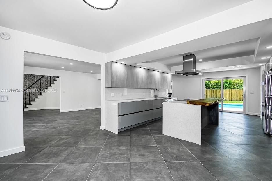 3010 Equestrian Drive Boca Raton, FL 33434 - Photo 18 of 53 a view of a kitchen with furniture and a window