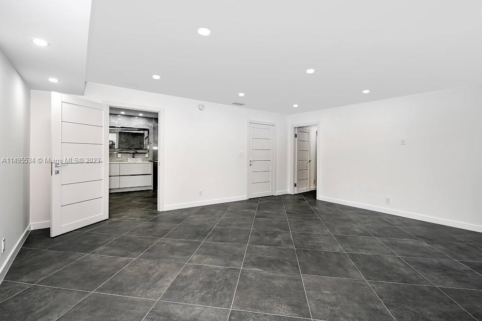 3010 Equestrian Drive Boca Raton, FL 33434 - Photo 29 of 53 a view of kitchen with refrigerator and microwave