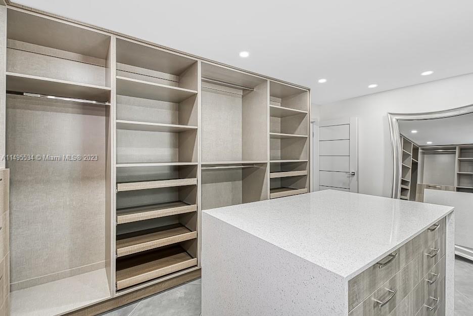 3010 Equestrian Drive Boca Raton, FL 33434 - Photo 34 of 53 a view of walk in closet with empty racks