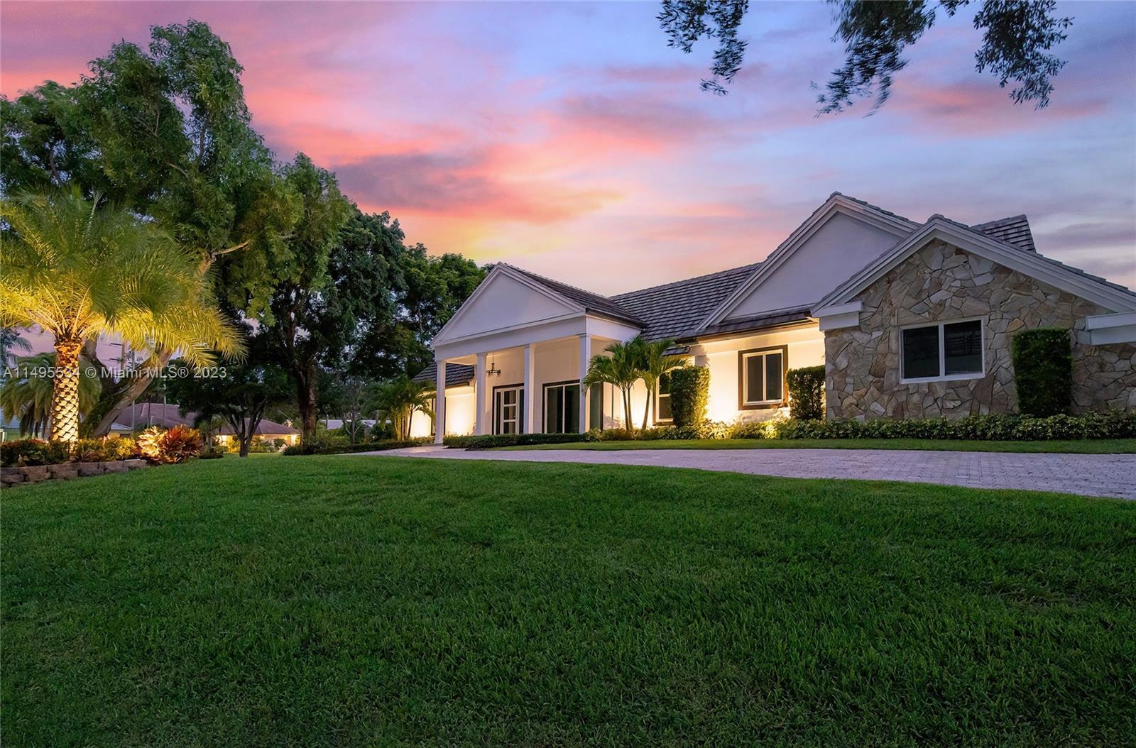 3010 Equestrian Drive Boca Raton, FL 33434 - Photo 4 of 53 a front view of a house with garden