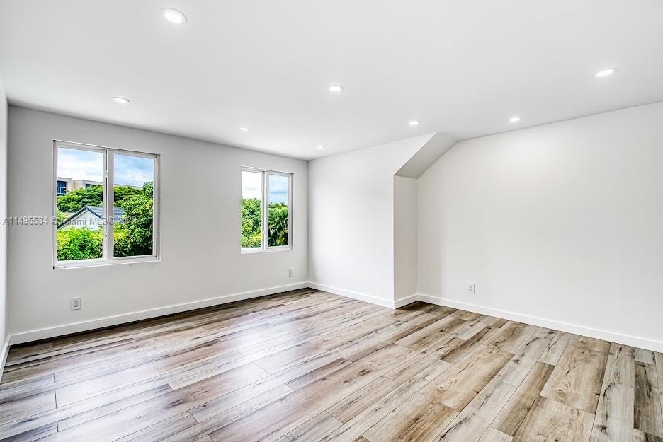 3010 Equestrian Drive Boca Raton, FL 33434 - Photo 48 of 53 a view of room with window and wooden floor