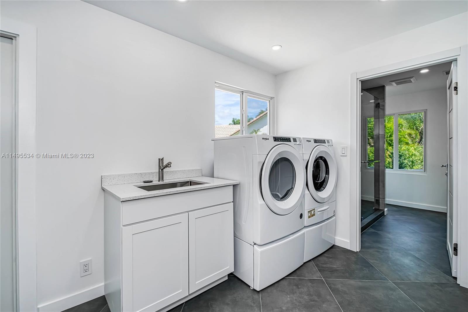3010 Equestrian Drive Boca Raton, FL 33434 - Photo 50 of 53 a utility room with dryer and washer