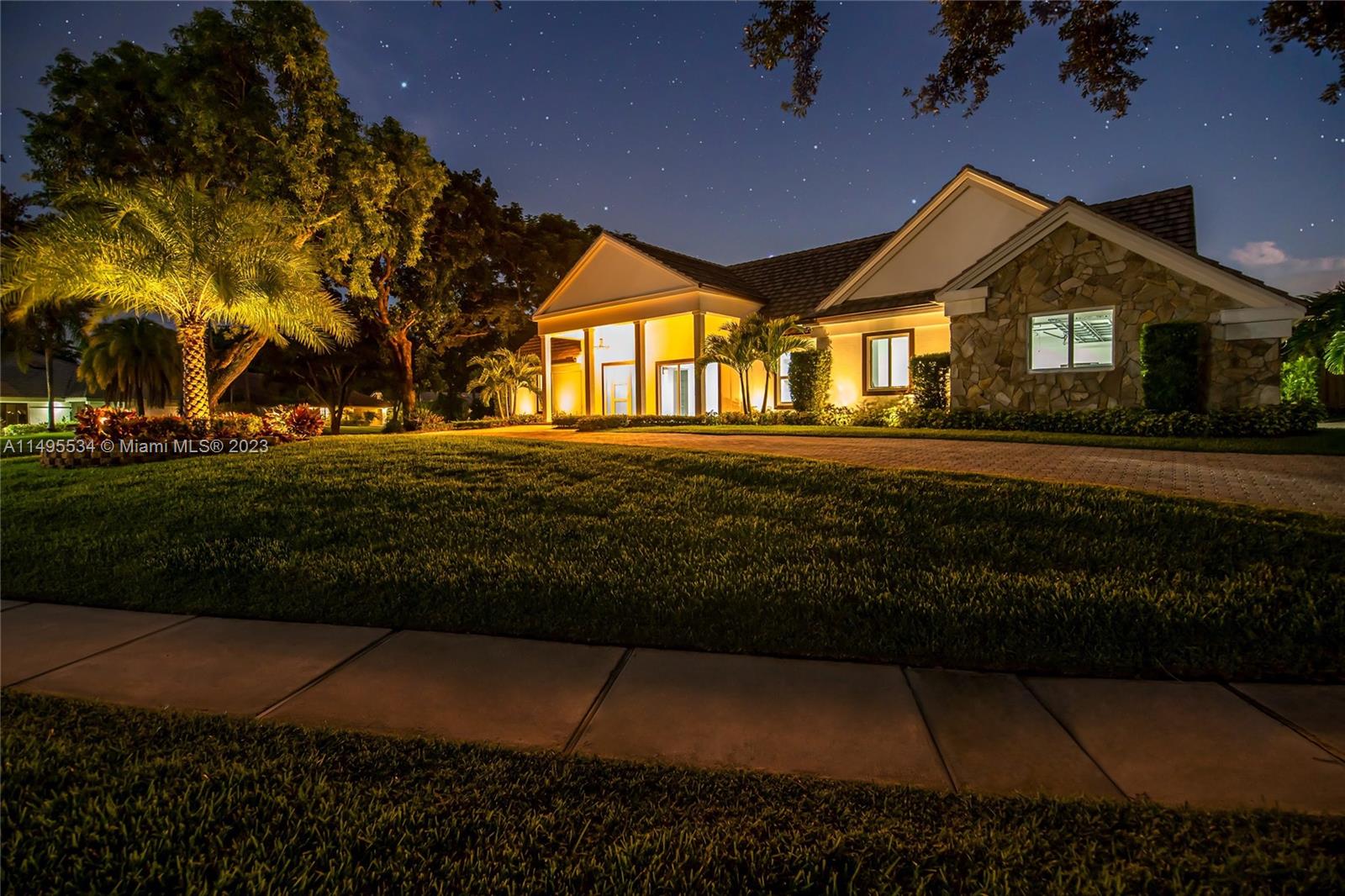 3010 Equestrian Drive Boca Raton, FL 33434 - Photo 6 of 53 a front view of house and yard