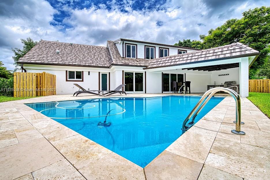 3010 Equestrian Drive Boca Raton, FL 33434 - Photo 10 of 53 a view of a house with swimming pool