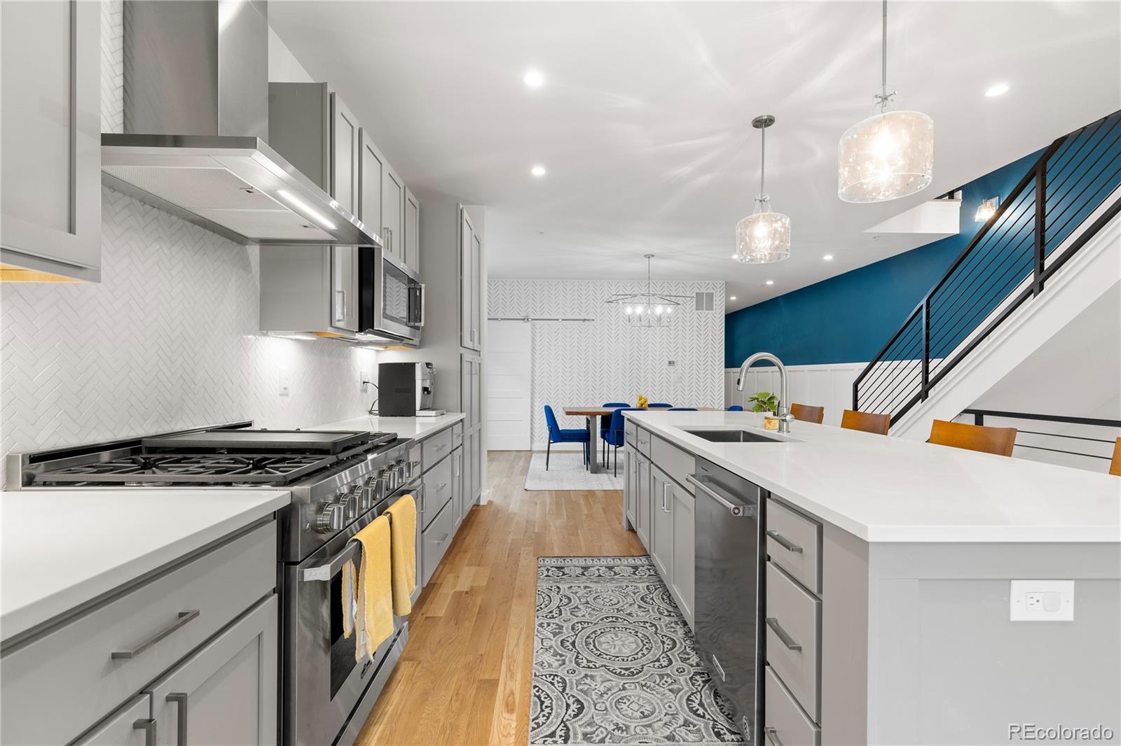 5327 Raleigh Street Denver, CO 80212 - Photo 11 of 40 a kitchen with a stove and a sink