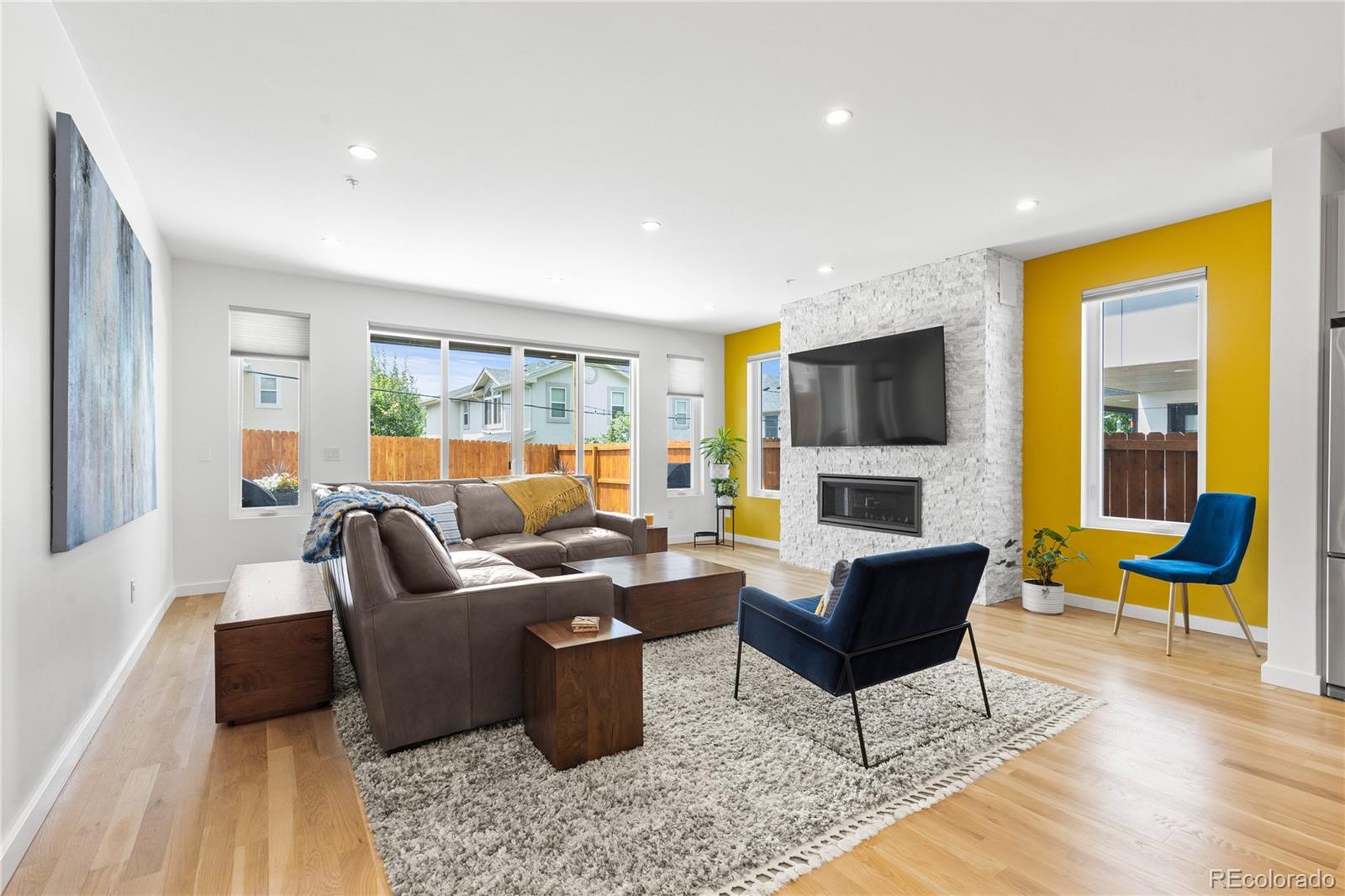 5327 Raleigh Street Denver, CO 80212 - Photo 13 of 40 a living room with furniture fireplace and a large window