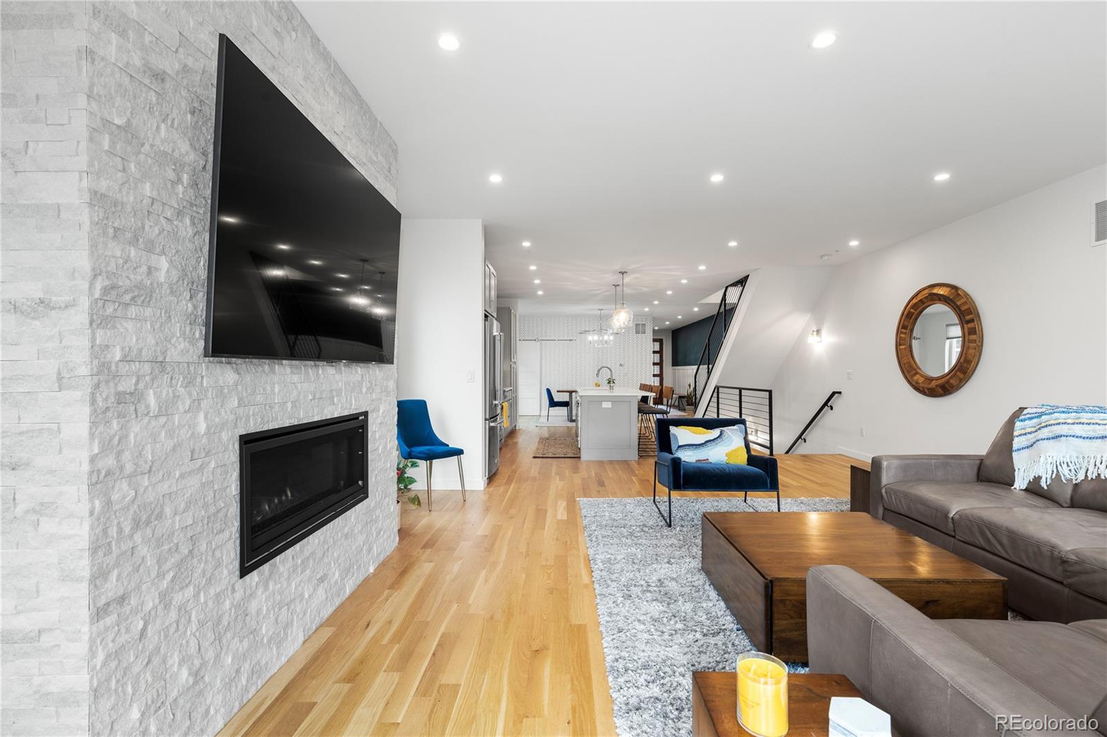 5327 Raleigh Street Denver, CO 80212 - Photo 15 of 40 a living room with furniture and a fireplace