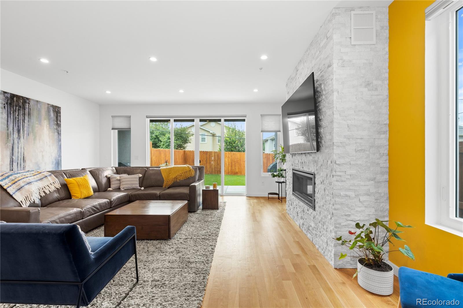 5327 Raleigh Street Denver, CO 80212 - Photo 16 of 40 a living room with furniture and wooden floor