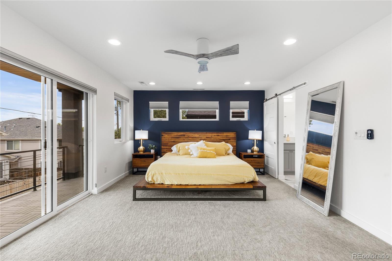 5327 Raleigh Street Denver, CO 80212 - Photo 20 of 40 a bed room with a bed and a walk in closet