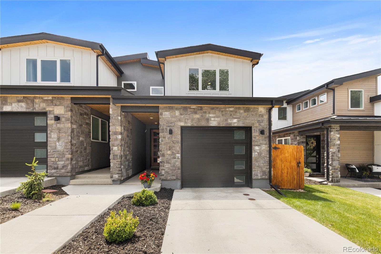 5327 Raleigh Street Denver, CO 80212 - Photo 2 of 40 a front view of a house with a yard