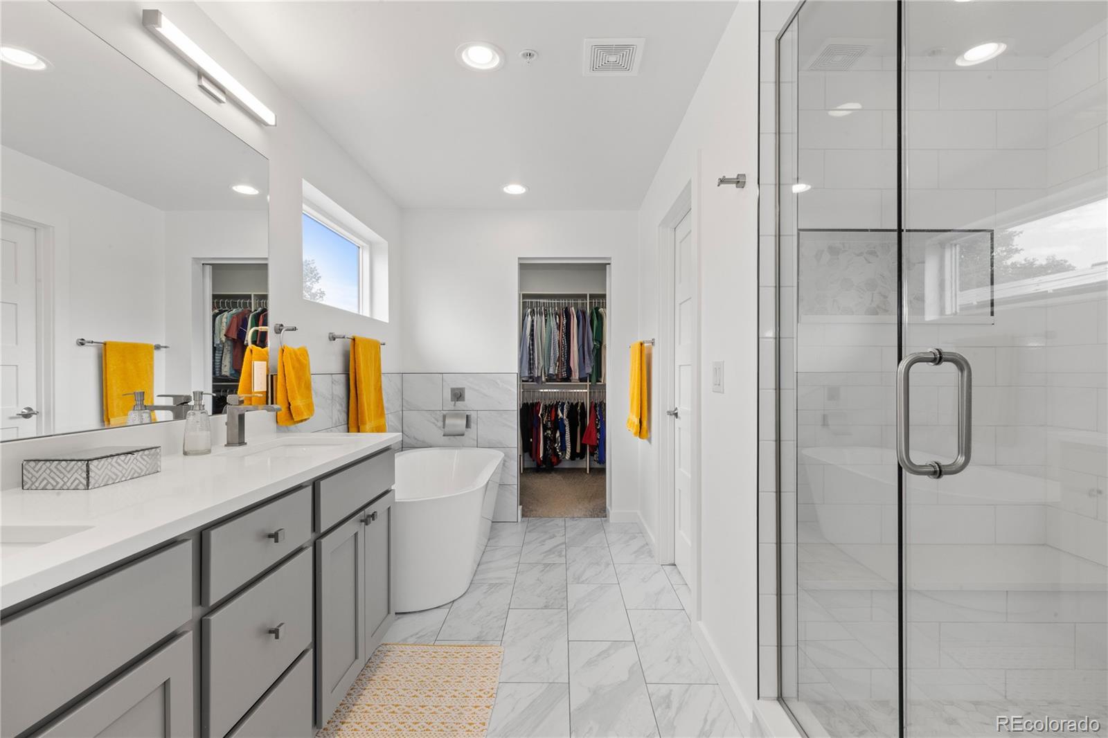 5327 Raleigh Street Denver, CO 80212 - Photo 23 of 40 a bathroom with a sink and a mirror