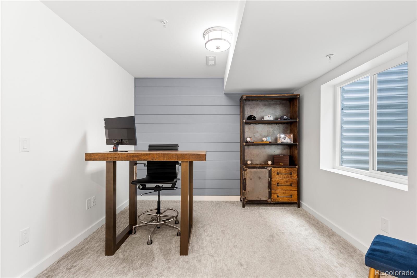 5327 Raleigh Street Denver, CO 80212 - Photo 31 of 40 a room that has a couch and a chair in it