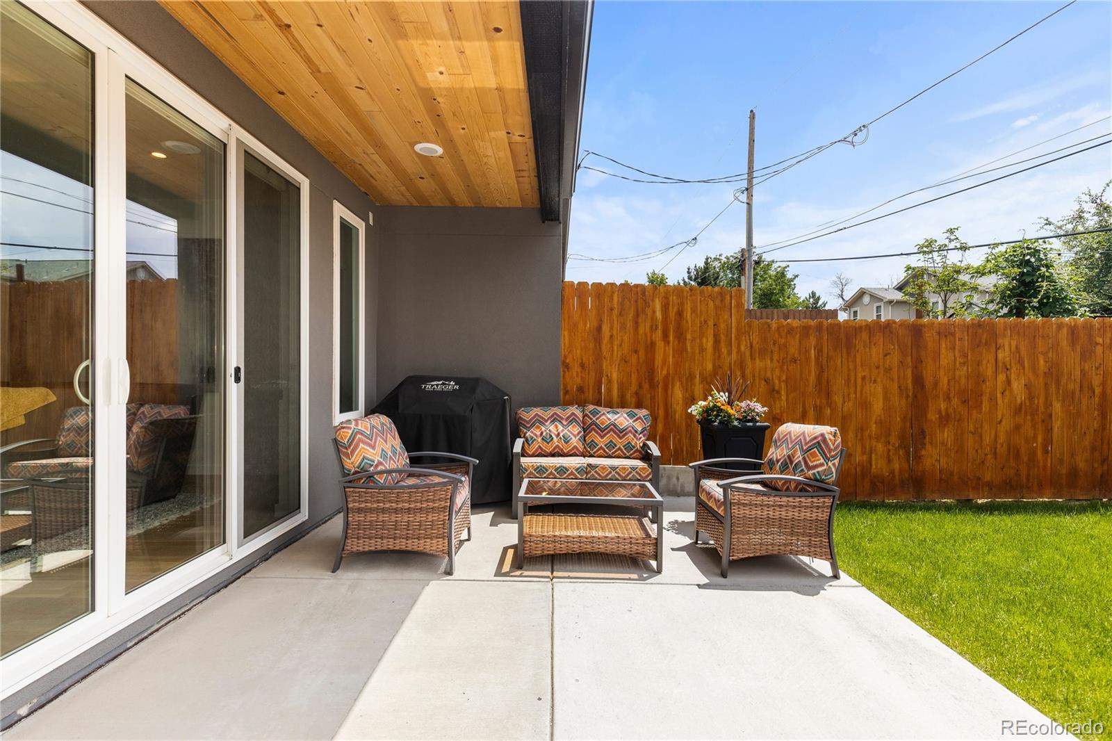 5327 Raleigh Street Denver, CO 80212 - Photo 36 of 40 a view of a chairs in back yard of the house