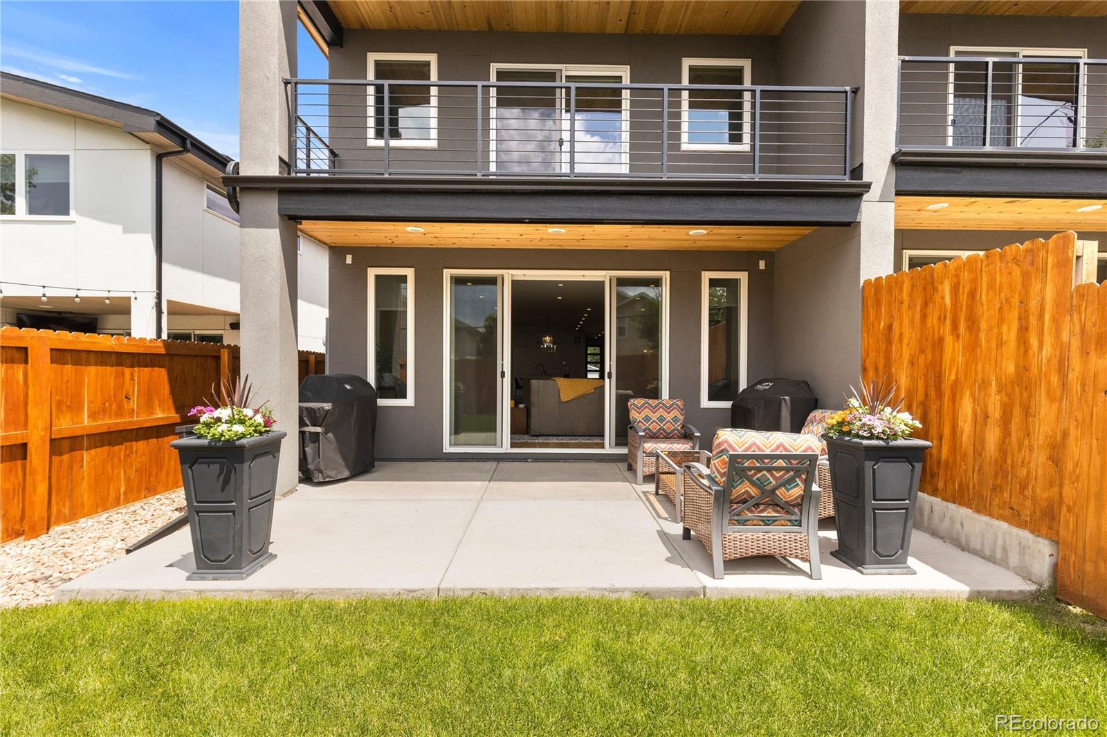 5327 Raleigh Street Denver, CO 80212 - Photo 37 of 40 a view of a house with backyard porch and sitting area