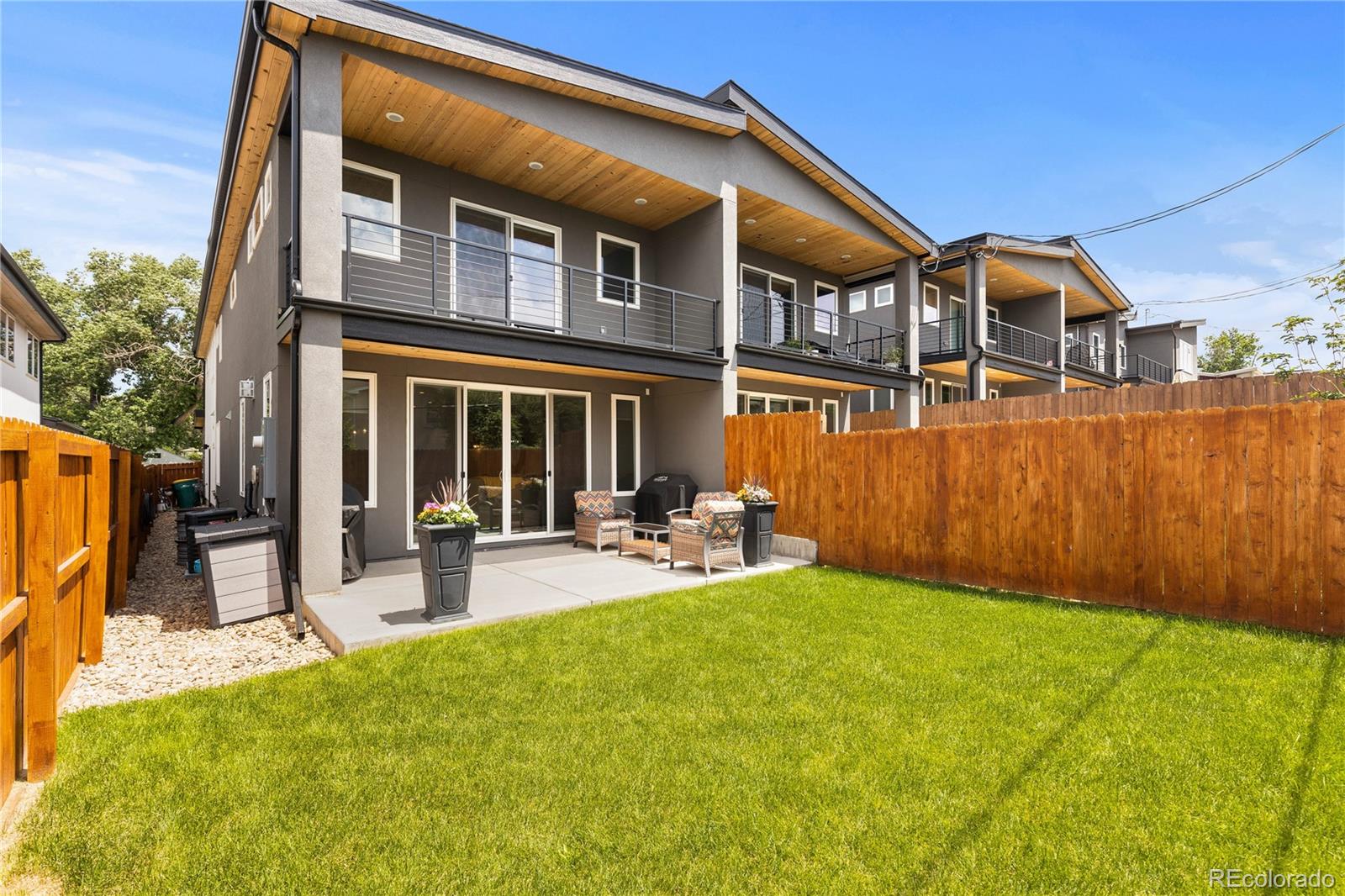 5327 Raleigh Street Denver, CO 80212 - Photo 38 of 40 a view of a house with backyard porch and sitting area