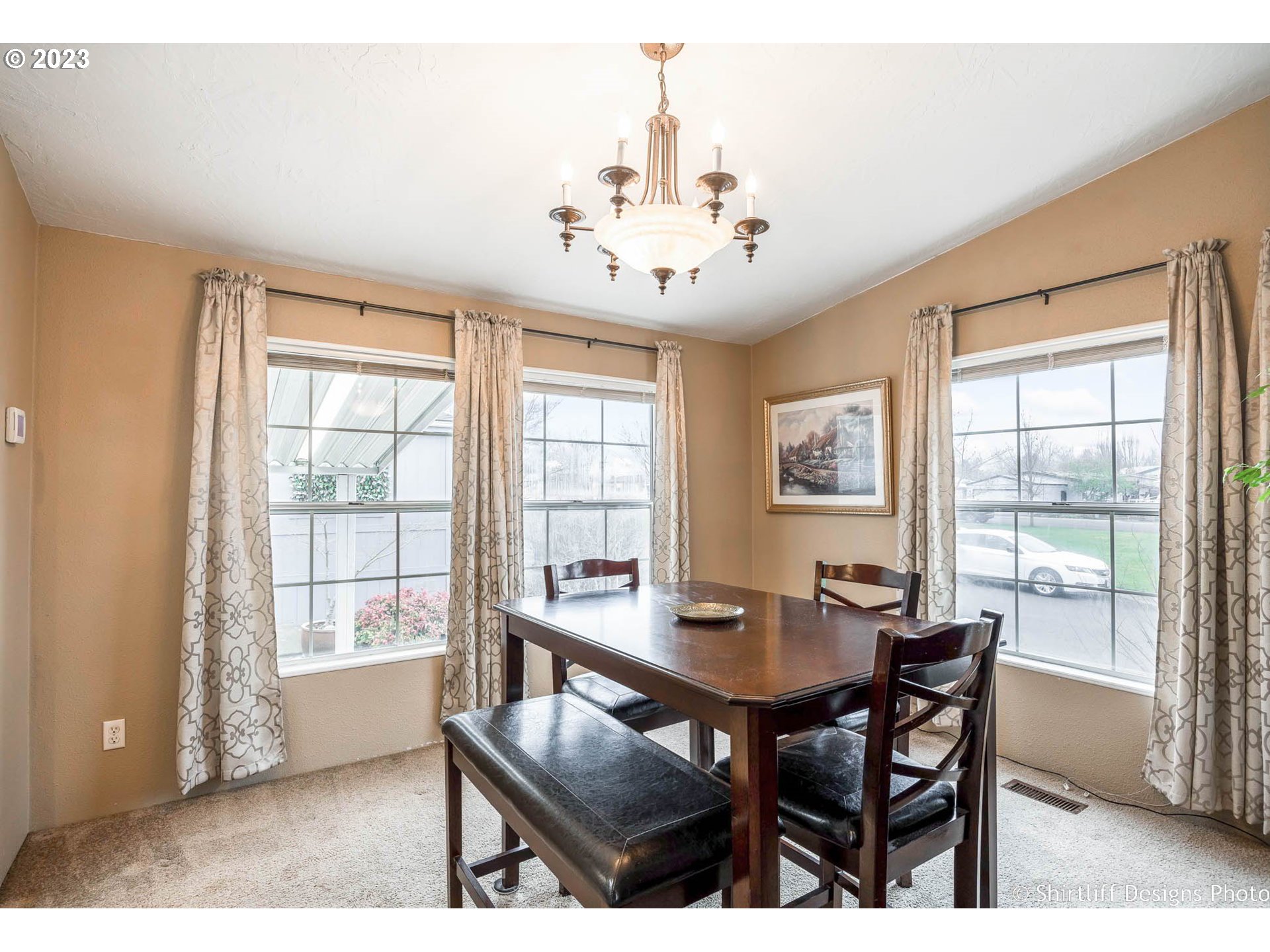 1699 North Terry Street, Unit 164 Eugene, OR 97402 - Photo 11 of 31 a view of a dining room with furniture window and outside view