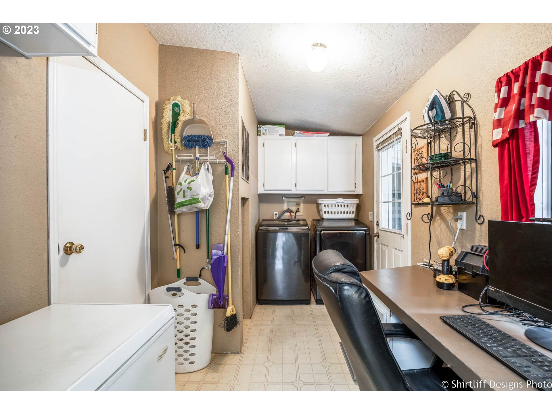 1699 North Terry Street, Unit 164 Eugene, OR 97402 - Photo 17 of 31 a bedroom with a bed and a flat tv screen on dresser
