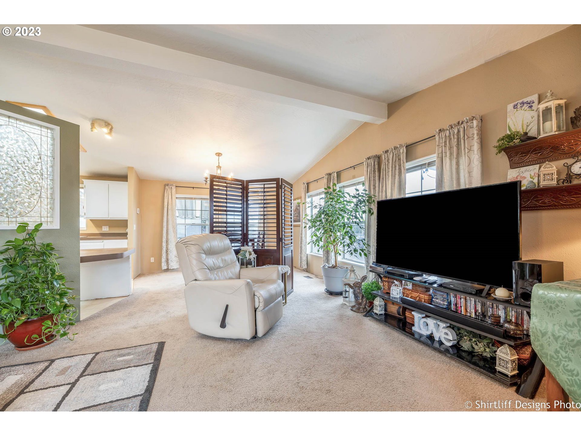 1699 North Terry Street, Unit 164 Eugene, OR 97402 - Photo 10 of 31 a living room with furniture and a flat screen tv